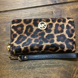 Micheal Kors faux fur leopard wallet. New without tags. Never used.